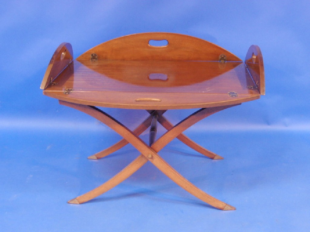 Appraisal: A reproduction mahogany Butler's tray table