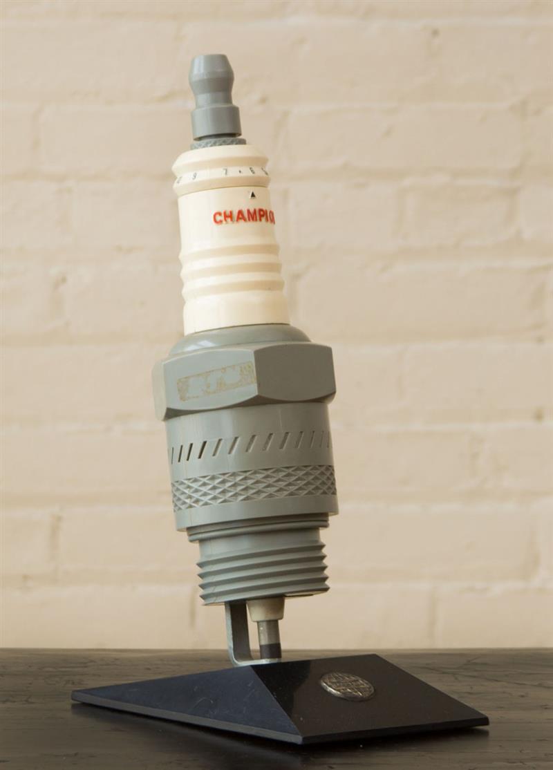 Appraisal: CHAMPION SPARK PLUG RADIO ON STAND Stand inset with metal