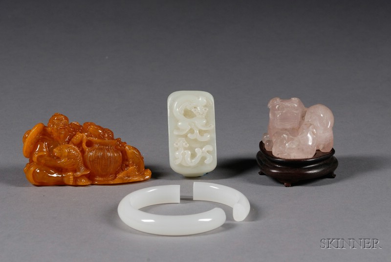 Appraisal: Four Carvings China th century a rose quartz foo dog