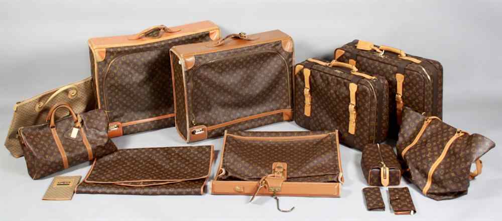 Appraisal: EXTENSIVE LOUIS VUITTON SUITE OF LUGGAGE including various soft-sided satchels