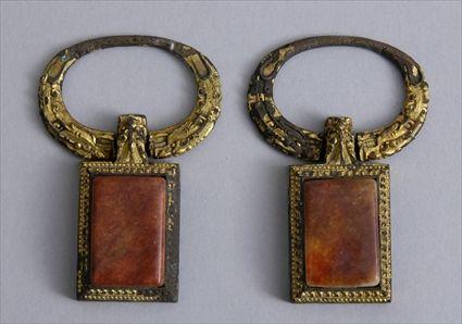 Appraisal: PAIR OF CONTINENTAL HARDSTONE-MOUNTED GILT-METAL PENDANTS Each rectangular stone within