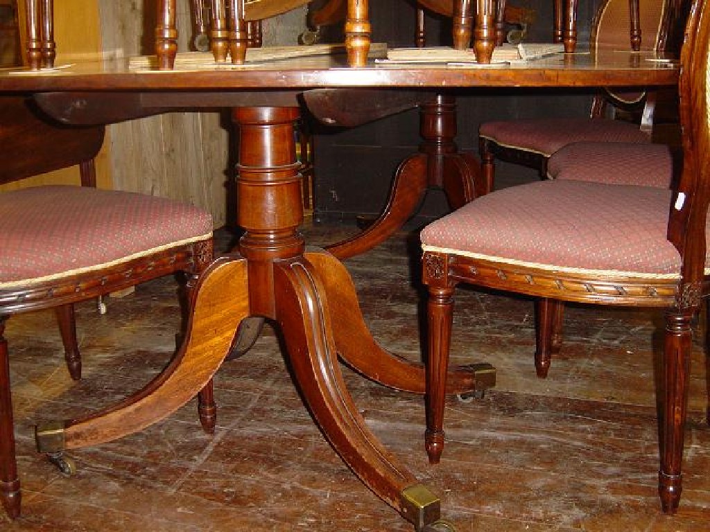 Appraisal: A Georgian mahogany D-end twin pedestal dining table fitted with