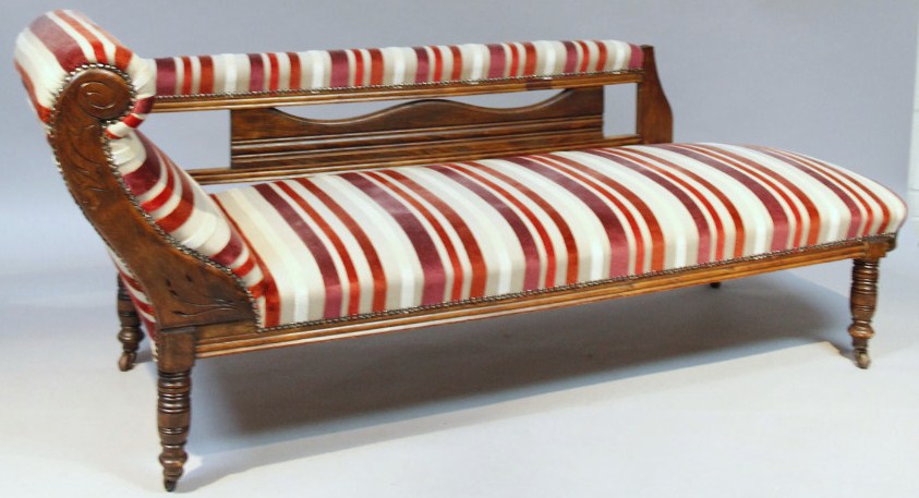 Appraisal: An Edwardian chaise longue with scroll side and part pierced