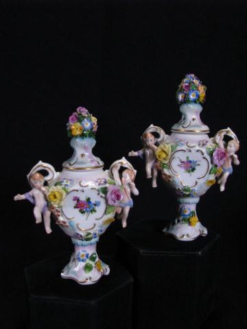 Appraisal: Pair of Miniature Dresden Lidded Urns '' high with putti