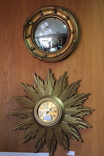 Appraisal: A SMALL REGENCY GILT FRAMED CONVEX MIRROR cm dia together