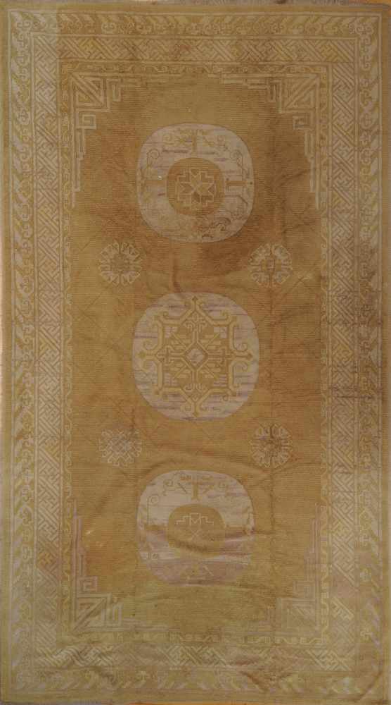 Appraisal: CHINESE WOOL HOOKED CARPET The three ivory ring medallions on