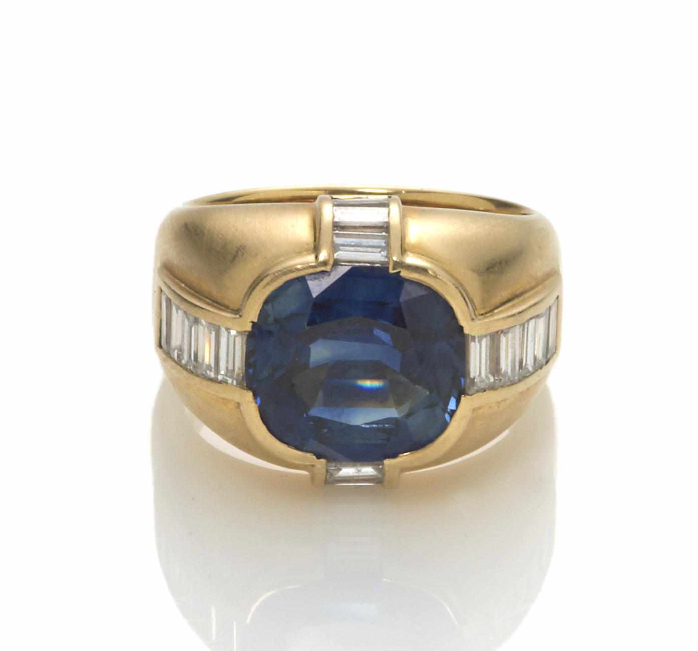 Appraisal: A sapphire and diamond ring cushion-cut sapphire weighing approximately carats