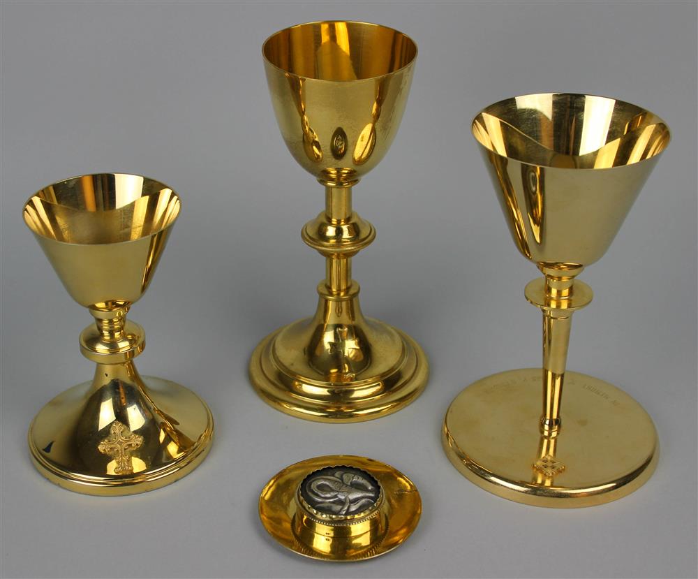 Appraisal: GROUP OF THREE BRASS CHALICES AND A SILVER-GILT PATEN WITH