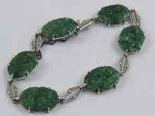 Appraisal: A jade bracelet set in white metal tests ct gold