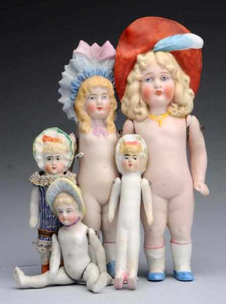 Appraisal: Lot of All-Bisque Dolls German bonnet dolls Girl with molded