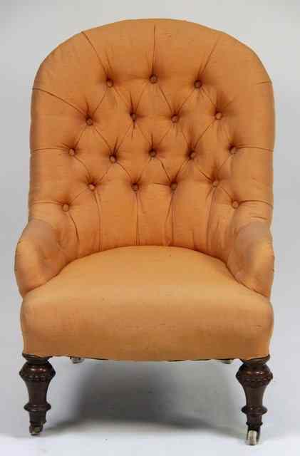 Appraisal: A nursing chair with deep button back the turned legs