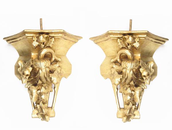 Appraisal: A pair of Continental Baroque style carved giltwood wall brackets