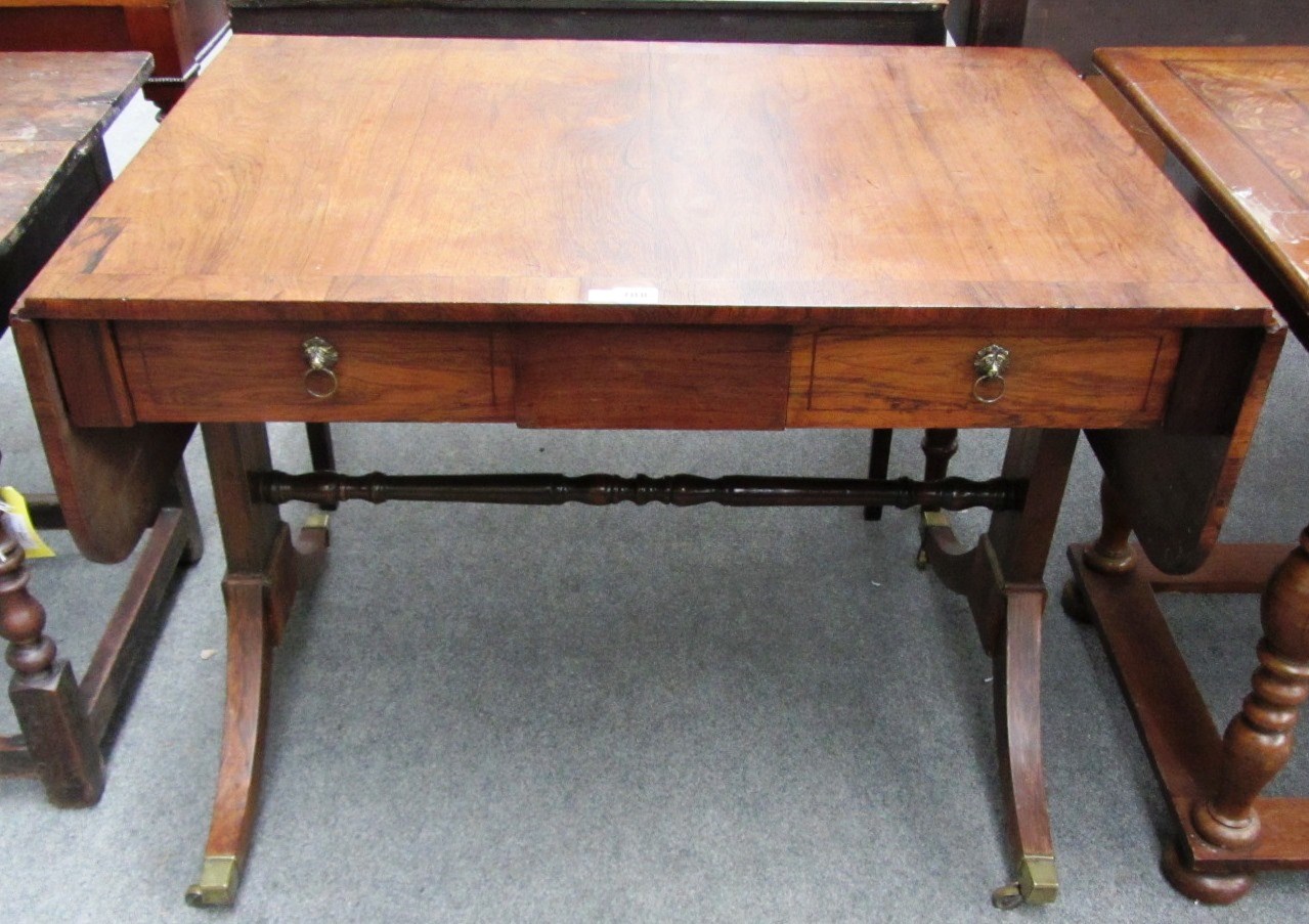 Appraisal: An early th century rosewood sofa table the drop flap