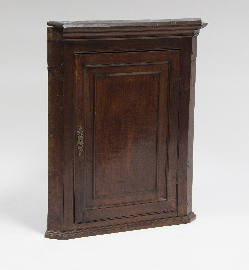 Appraisal: A th Century oak hanging corner cupboard with panelled door