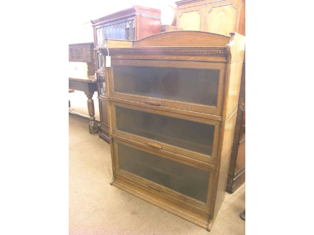 Appraisal: An oak Globe-Wernicke style bookcase three glazed sections ft in