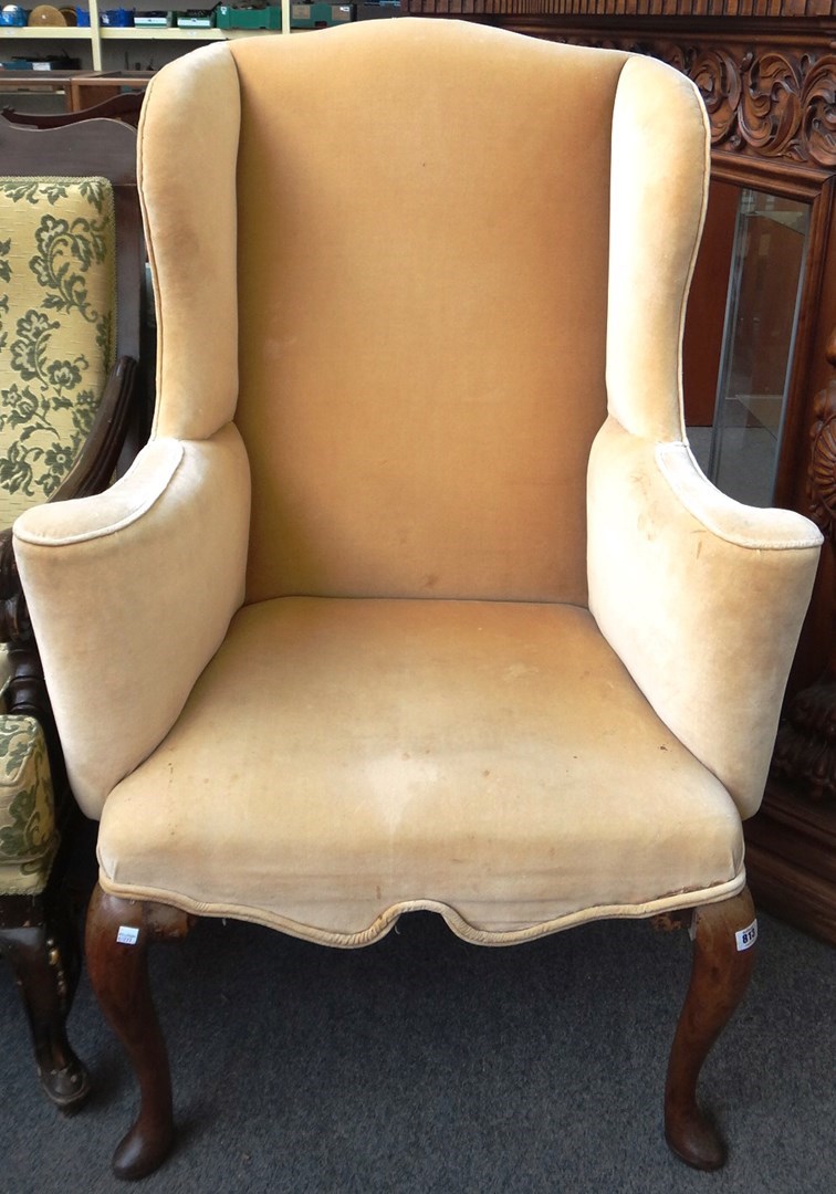 Appraisal: An early th century style wingback armchair on tall cabriole