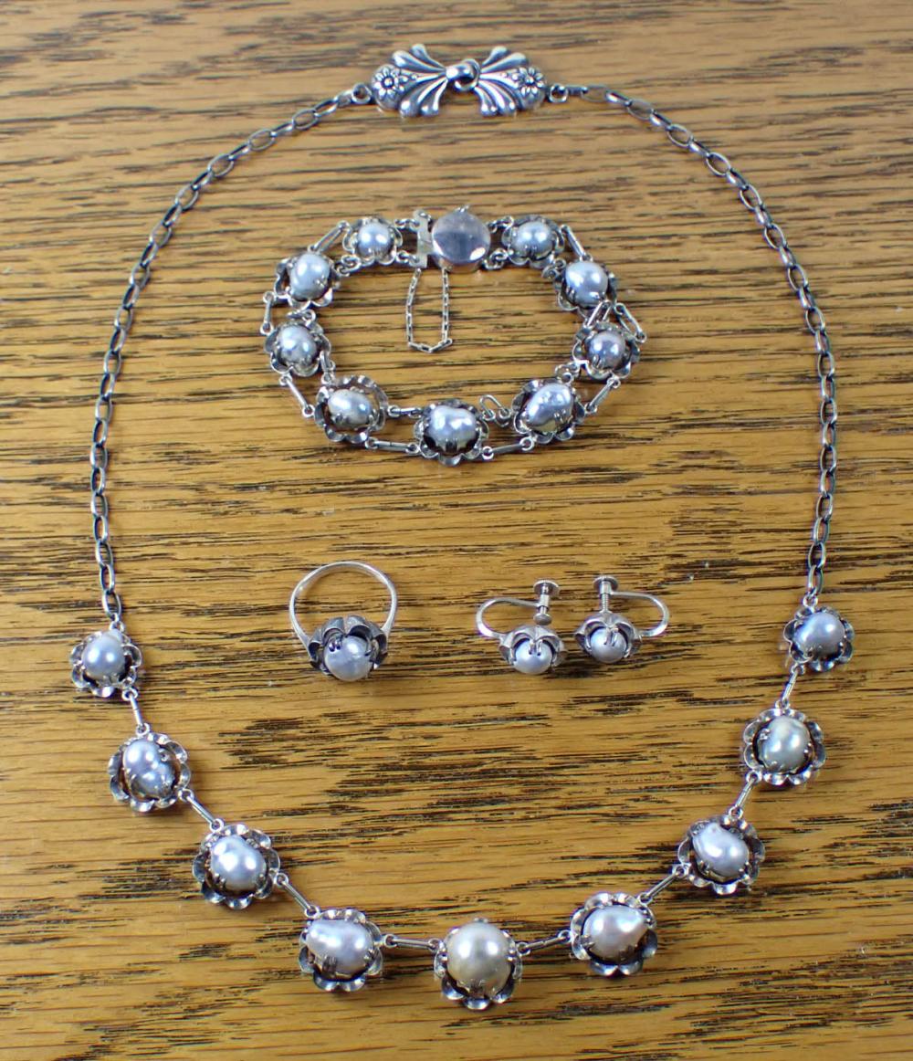 Appraisal: FIVE PIECE ANTIQUE PEARL AND SILVER JEWELRY SET including a