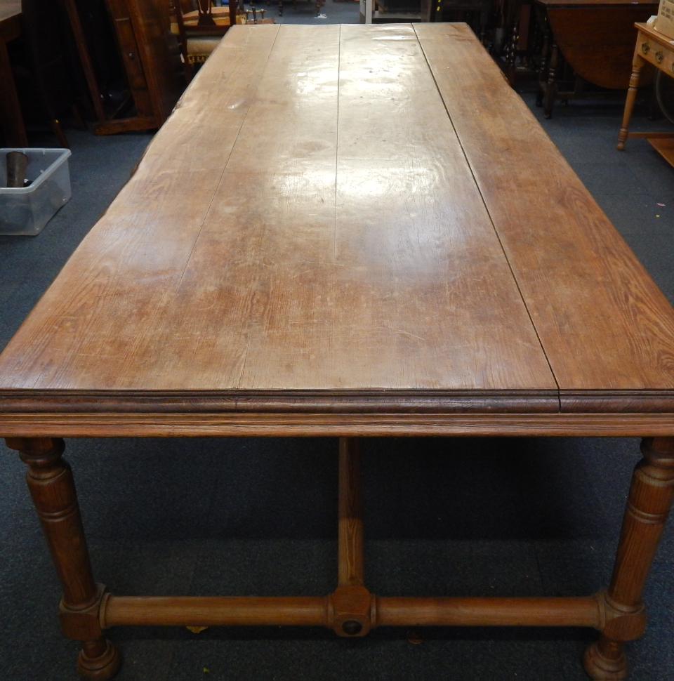 Appraisal: A rectangular pine refectory table raised on turned legs and