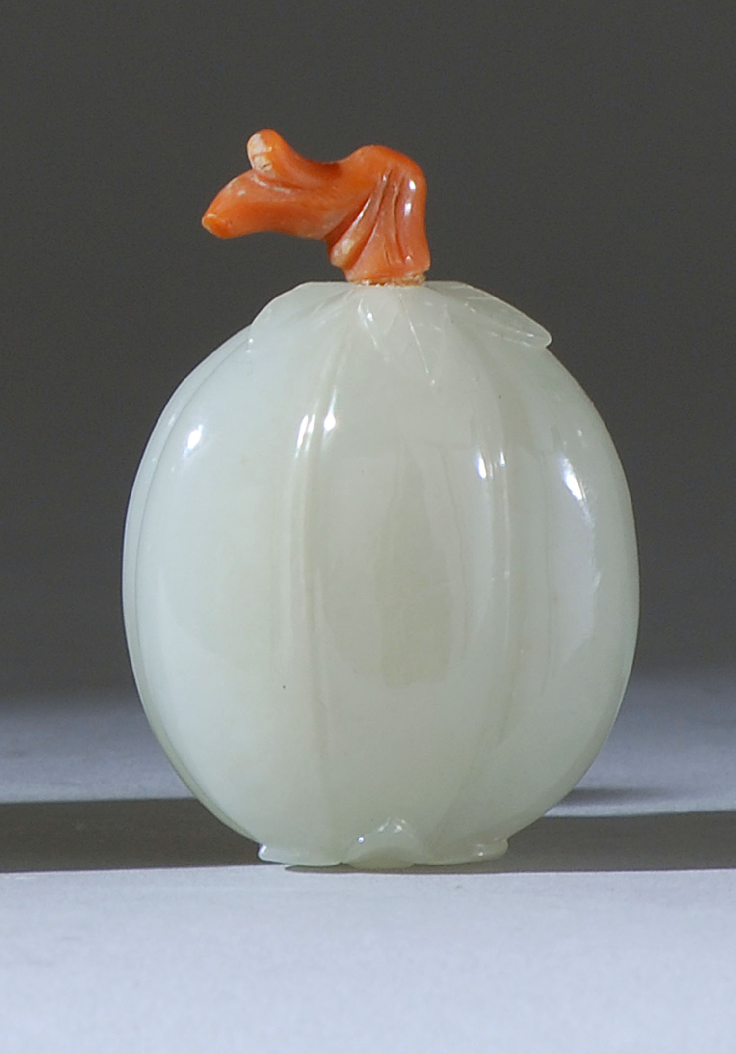 Appraisal: WHITE JADE SNUFF BOTTLE In fruit and flower blossom form