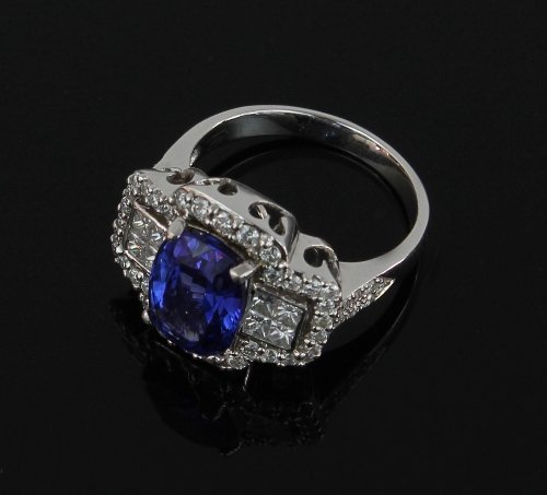 Appraisal: A tanzanite and diamond dress ring the cushion-shaped central stone