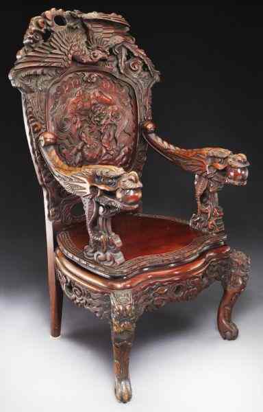 Appraisal: Japanese carved high back armchair the crest depicting a deeply