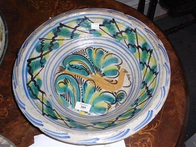 Appraisal: AN ANTIQUE FAIENCE STONEWARE BOWL possibly French painted with a