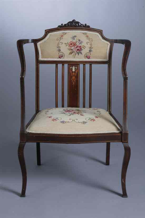 Appraisal: EDWARDIAN INLAID MAHOGANY UPHOLSTERED OPEN-ARM CHAIR Crest panel and seat