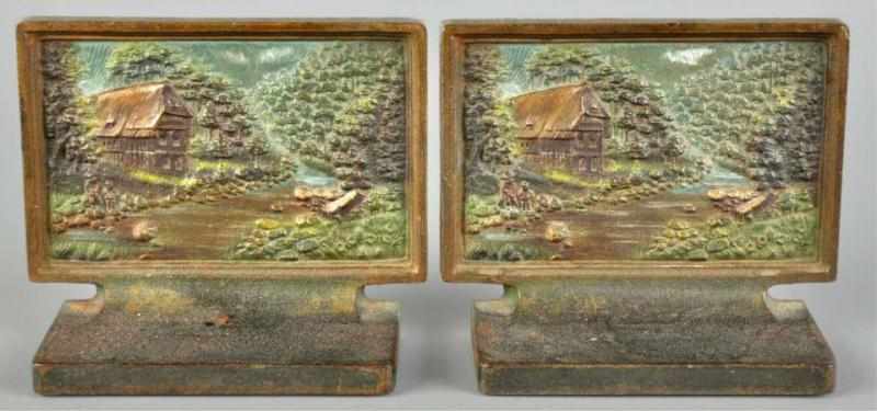 Appraisal: Pair of Cast Iron Cottage in Woods Bookends Description Marked