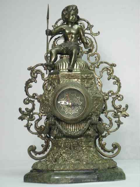 Appraisal: French ormolu brass figural mantle clock Pierced brass fretwork decoration