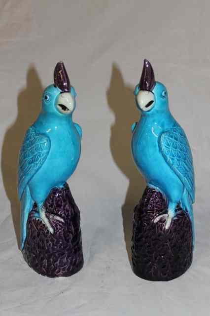 Appraisal: A PAIR OF CHINESE TURQUOISE BLUE MODELS OF PARROTS each