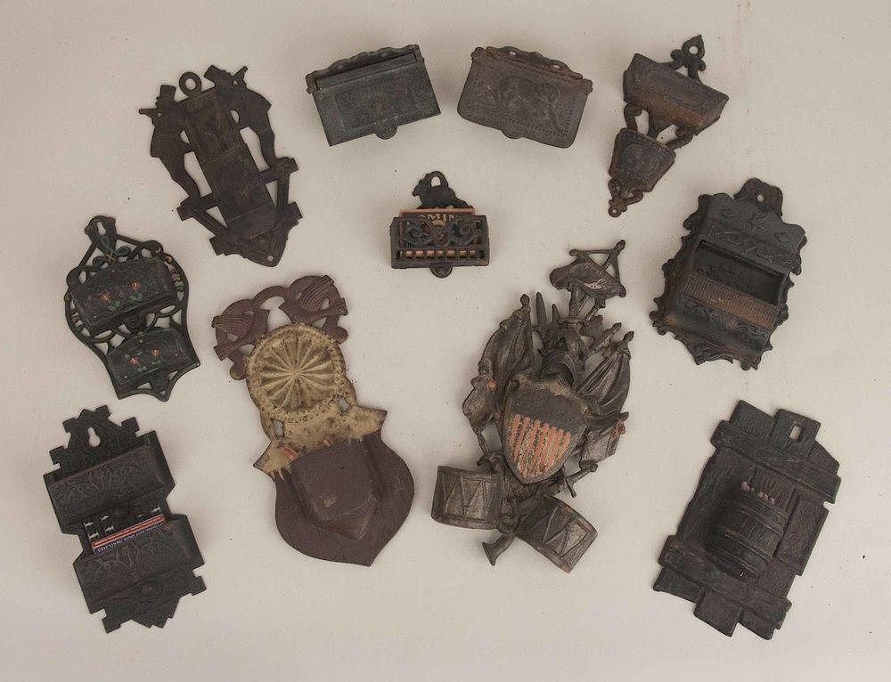 Appraisal: Eleven Cast Iron Match Holders Eleven assorted cast iron match