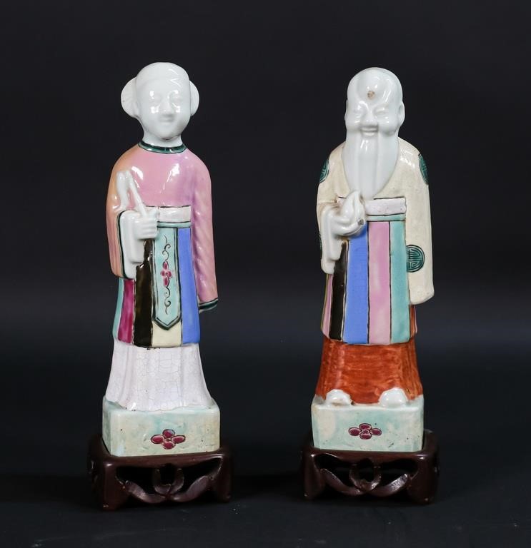 Appraisal: Two Chinese porcelain immortals on wooden stands some crazing on