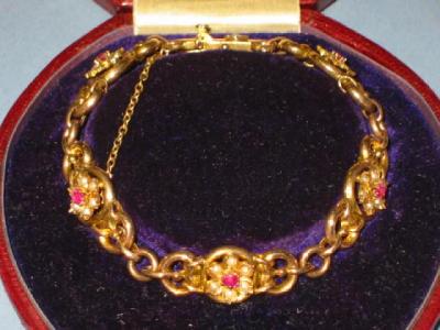 Appraisal: A VICTORIAN RUBY AND SEED PEARL BRACELET the circular ct