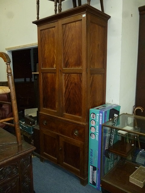 Appraisal: A VICTORIAN MAHOGANY LINEN PRESS with panelled cupboards above over