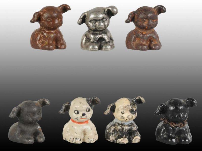 Appraisal: Lot of Puppo Dog Cast Iron Paperweights Description One is