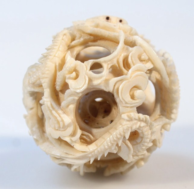 Appraisal: A later Meiji period Japanese ivory puzzle ball of shaped