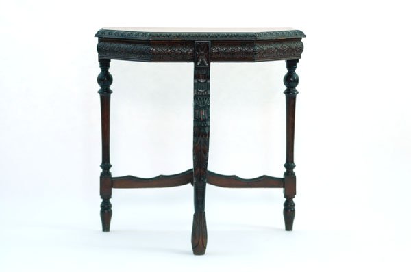 Appraisal: Small six sided side table with carved skirt and front