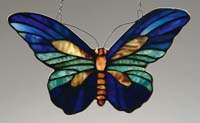 Appraisal: TIFFANY BUTTERFLY SUN-CATCHER Stained glass colors of blue cream beige