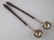 Appraisal: A pair of small toddy ladles with turned hardwood handled