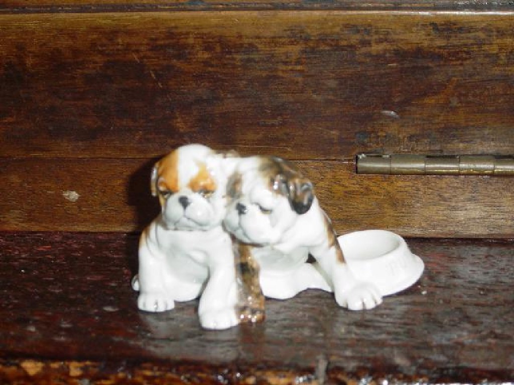 Appraisal: A Royal Worcester group of a pair of Bulldog puppies