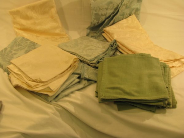 Appraisal: Four round Damask tablecloths green and ivory with matching napkins