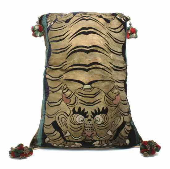 Appraisal: A Cut Silk Pillow depicting a stylized tiger together with