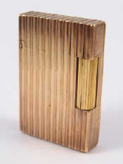 Appraisal: A gold plated cigarette lighter by S J Dupont approx