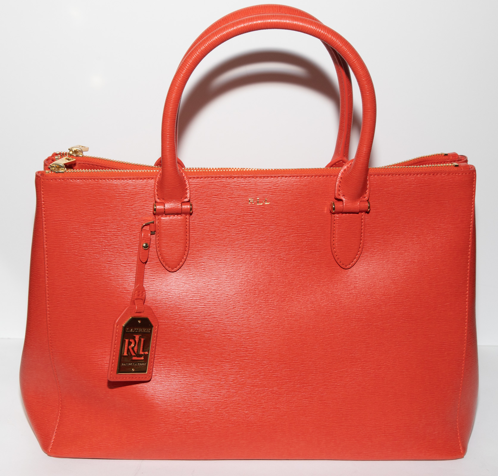 Appraisal: LAUREN BY RALPH LAUREN ORANGE LEATHER HANDBAG includes dust bag