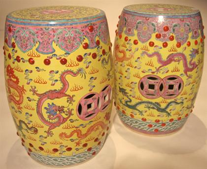 Appraisal: Pair of Chinese yellow glazed garden seats Of cylindrical form