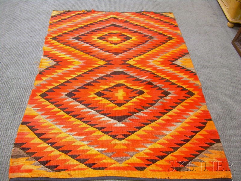 Appraisal: Navajo Rug red brown and tan geometric patterns approx lg