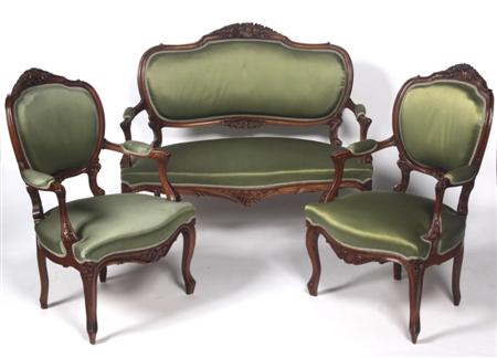 Appraisal: A Victorian mahogany three piece parlour suite each with foliate