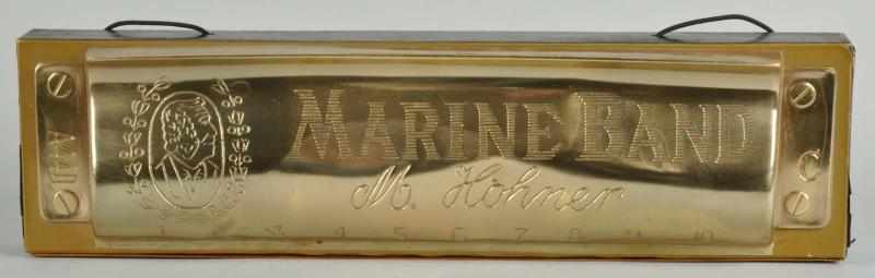 Appraisal: Tin Wood Marine Band Harmonica Trade Sign Description Beautiful etching