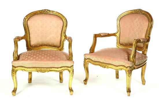 Appraisal: PAIR OF LOUIS XV-STYLE ARMCHAIRS European early th century hardwood