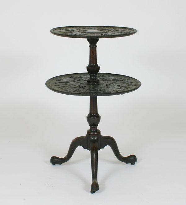 Appraisal: Heavily carved two-tier table tripod base pad feet extensive foliate